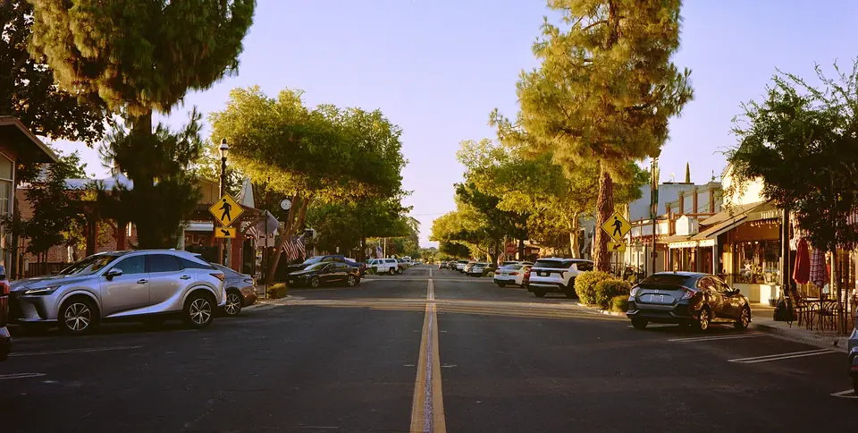 Pollasky Avenue in Old Town Clovis, lined with trees and storefronts