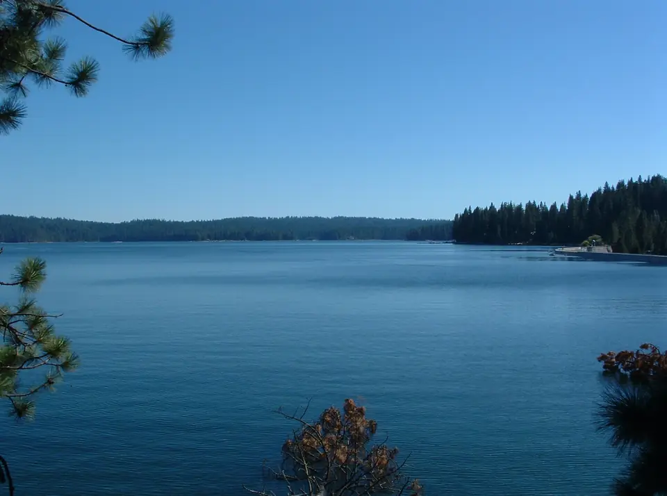 Shaver Lake's blue water and pine-covered shoreline