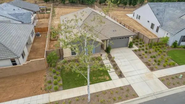 Drone photo showing a home and its quarter-acre lot